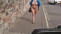 Walking barefoot from her flat…