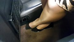 Woman in shiny nude pantyhose and flats in train