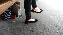 Beautiful feet in black flats