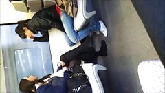 Girl in black tights and flats on train
