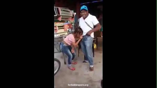 Latina girl making a blowjob at a reggaeton party