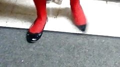 Red pantyhose with black flats